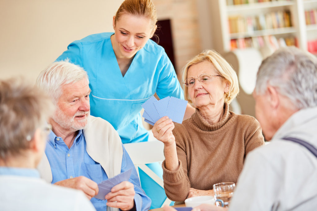 Senior Woman has fun playing cards